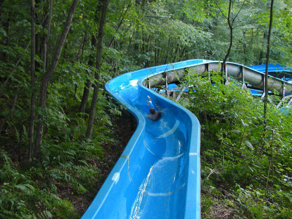 boy sliding down one of our lower water slides