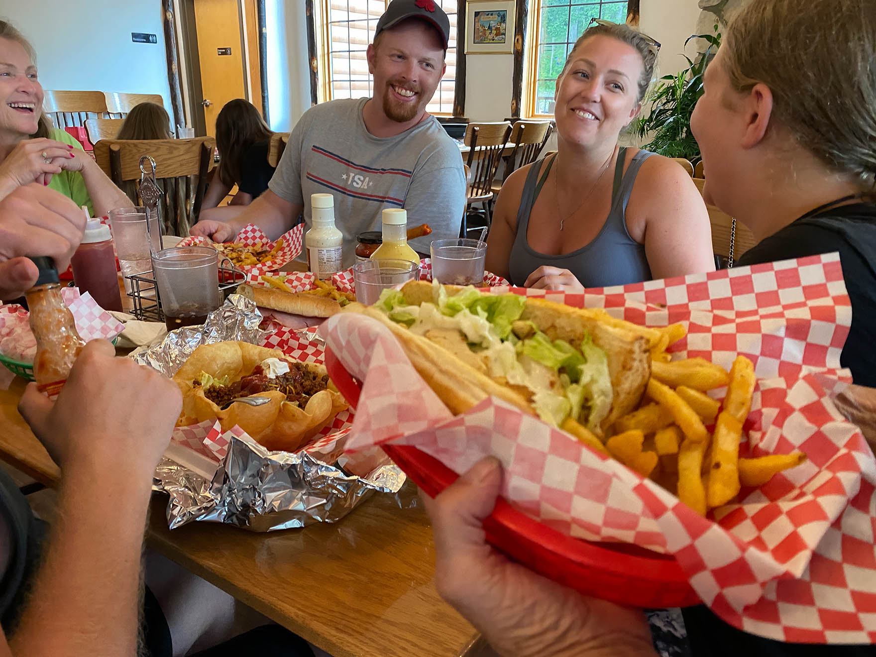 family enjoying great food at Cindy Bear's Kitchen at Mill Run Jellystone, closest Jellystone Park to Pittsburg PA
